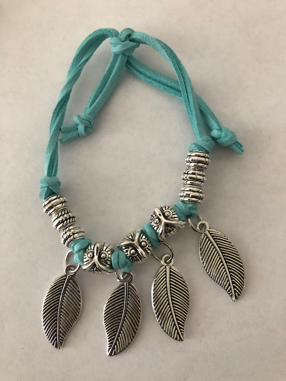 Jewelry set | Bracelet with feather charms and a pair of hoops