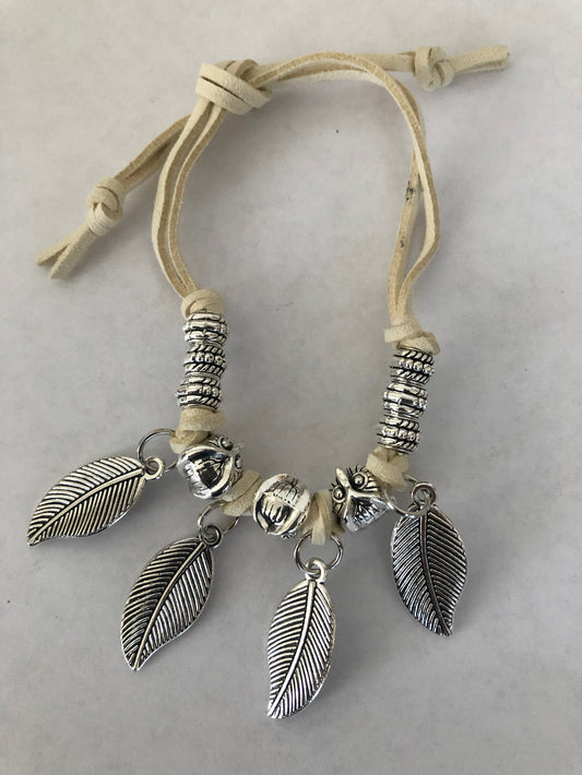 Jewelry set | Bracelet with feather charms and a pair of hoops